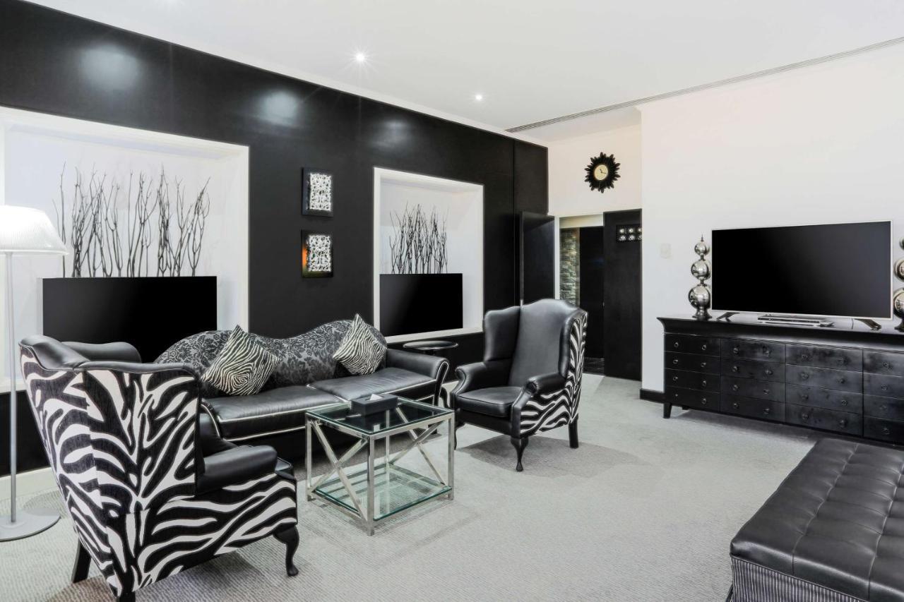 Radisson Blu Resort, Шарджа Экстерьер фото A living room with zebra print furniture