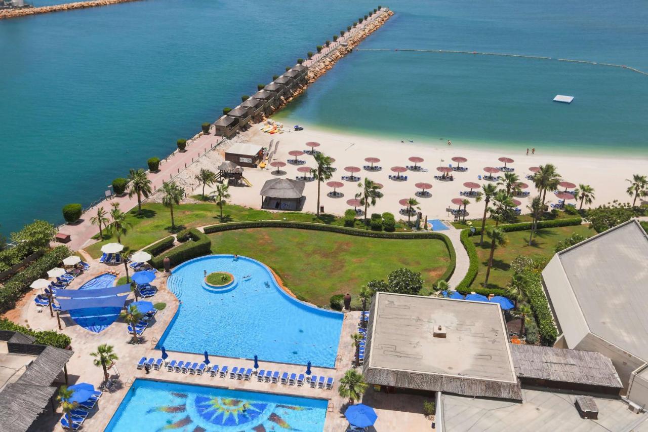 Radisson Blu Resort, Шарджа Экстерьер фото The beach at Jumeirah Beach Hotel