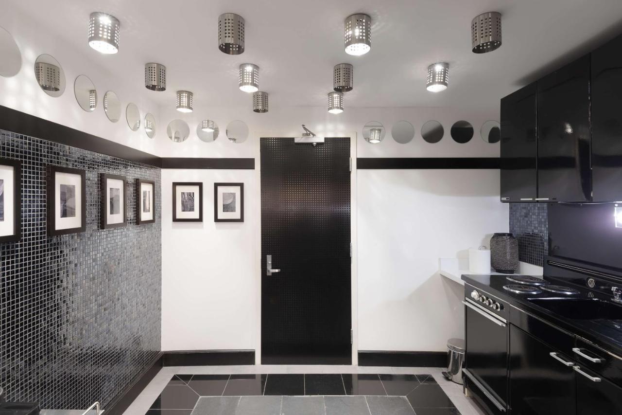 Radisson Blu Resort, Шарджа Экстерьер фото A kitchen with a concealed door